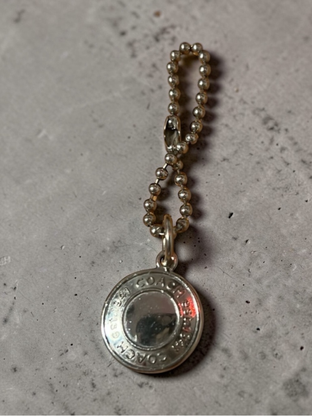 Coach Silver Medallion Hang Tag